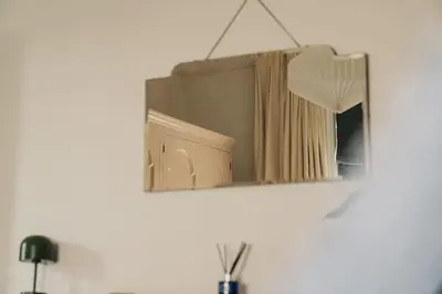 a mirror hanging on a wall in a room at Pier View Felixstowe - Sea View, 50m from the beach in Felixstowe