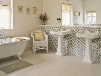 a bathroom with two sinks and a bath tub and a bath tub at Bridge House at Woodhall Estate in Hertford