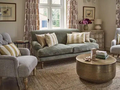 a living room with a couch and a coffee table at Bridge House at Woodhall Estate in Hertford