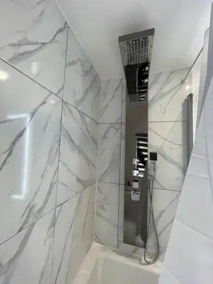 a white bathroom with a shower and a sink at Luxurious 2 bed home in Basildon in Basildon