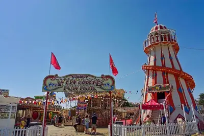 a carnival ride with a ferris wheel at 2br-sleeps6-wifi-freeparking-holidaypark in Clacton-on-Sea