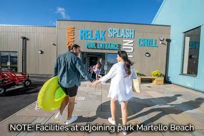 a man and a woman holding hands in front of a store at 2br-sleeps6-wifi-freeparking-holidaypark in Clacton-on-Sea
