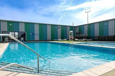 a large swimming pool in front of a building at 2br-sleeps6-wifi-freeparking-holidaypark in Clacton-on-Sea