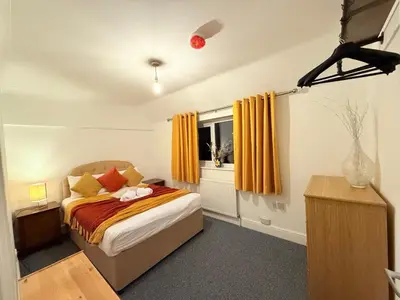 a bedroom with a bed and a window at Comfy, king bed families & Contractors welcome in St Ives