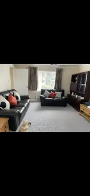 a living room with two couches and a window at Comfy, king bed families & Contractors welcome in St Ives
