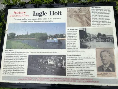 an article in a newspaper about a river at Contractor, families and bikes in Earith