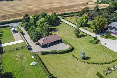 an aerial view of a house with a large yard at The Stables Rectory Farm in Halstead