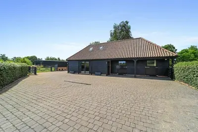 a building with a brick driveway in front of it at The Stables Rectory Farm in Halstead