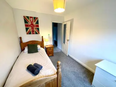 a bedroom with a bed in a room at Large 5 bed detached house near Stansted Airport with Parking for 2 vehicles! Stansted Stays in Stansted Mountfitchet