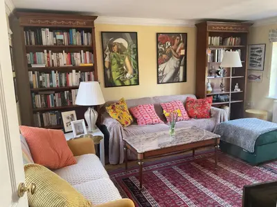 a living room with a couch and a table at Peaceful house ideal for dogs lovely location in Aldeburgh