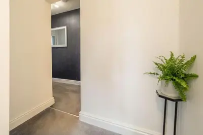 a hallway with a plant sitting on a table at Crown Street 4 in Bury Saint Edmunds