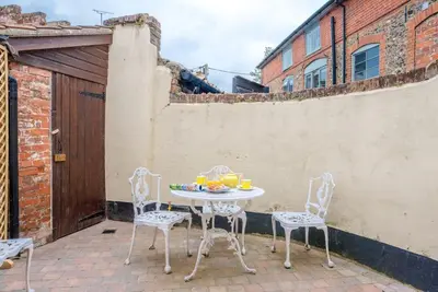 a table and chairs sitting on a patio at No. 10, The Cottage in Framlingham