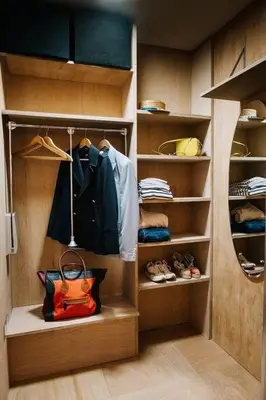 a walk in closet with a purse and shoes at Seahorse Studio, Aldeburgh in Aldeburgh