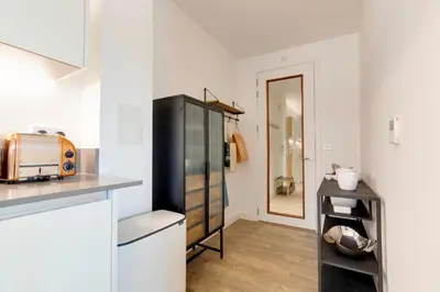 a kitchen with a black refrigerator and a counter at Pass the Keys Stunning and Spacious Modern Flat - Own Car Park in Cambridge