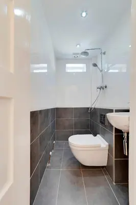 a bathroom with a toilet and a sink at Pass the Keys Modern & Spacious 1 Bed Terrace with Free Parking in Cambridge