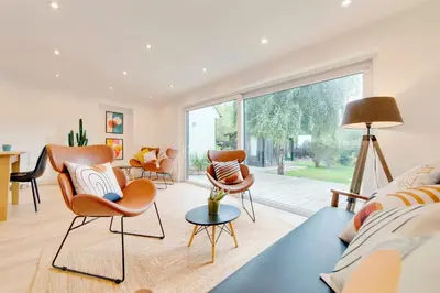 a living room with furniture and a large window at Pass the Keys 49 Byron Square Modern and Spacious 3 Bed Home with Free Parking in Cambridge