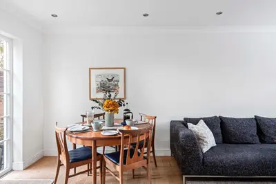 a living room with a table and a couch at Beautiful Apartment Wendens Ambo in Wendens Ambo