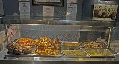 a display case with many different types of food at The George Hotel in Chatteris