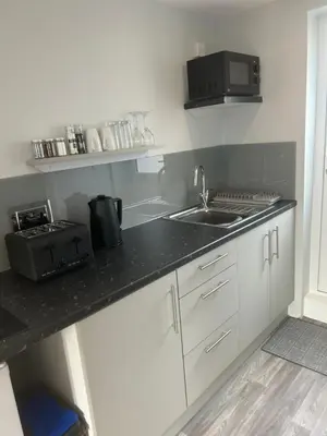 a kitchen with a sink and a counter top at 29a in Downham Market