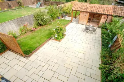 an aerial view of a garden with a patio at Hole in One in Aldeburgh