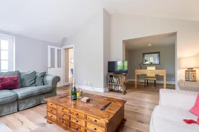 a living room with a couch and a coffee table at Salt Cellar Cottage, Aldeburgh - Aldeburgh Coastal Cottages in Aldeburgh