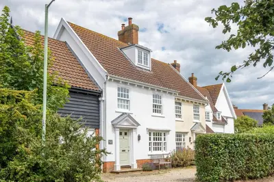 a white house with a brown roof at Salt Cellar Cottage, Aldeburgh - Aldeburgh Coastal Cottages in Aldeburgh