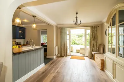 a kitchen with a sink and a counter top at Salt Cellar Cottage, Aldeburgh - Aldeburgh Coastal Cottages in Aldeburgh