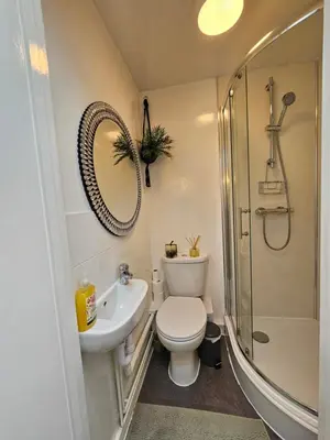 a bathroom with a toilet and a sink and a shower at Luxury Studio Stevenage in Stevenage