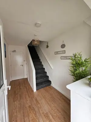 a stairway with a black and white staircase at Luxury Studio Stevenage in Stevenage