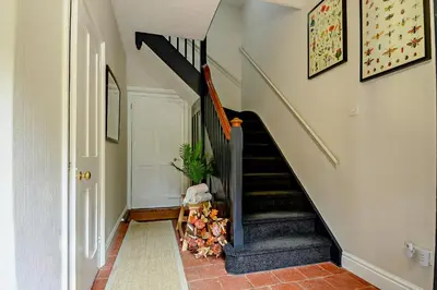 a staircase in a home with a stair case at Gardeners Cottage - Nowton Park in Bury Saint Edmunds
