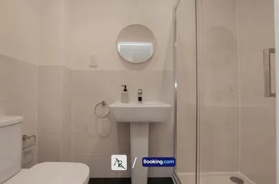 a bathroom with a shower and a sink and a toilet at Luxury House By AR Properties Short Lets & Serviced Accommodation Colchester in Colchester