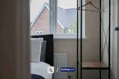 a bedroom with a bed and a window at Luxury House By AR Properties Short Lets & Serviced Accommodation Colchester in Colchester