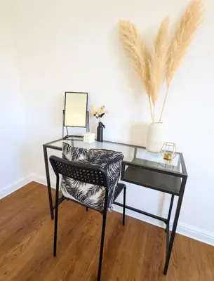 a glass desk with a chair and a mirror at 3-Bed, Sleeps 6, 1 Bath, Parking, WiFi in Ipswich