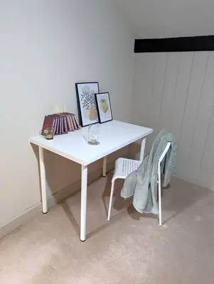 a white desk with a chair and pictures on it at 3-Bed, Sleeps 6, 1 Bath, Parking, WiFi in Shalford