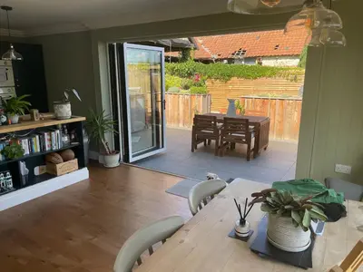 a dining room with a table and chairs and a dining room at Hall Farm Cottage, Barham in Ipswich