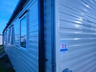 a side of a house with a speed limit sign on it at Ultimate serene getaway in East Mersea