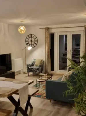 a living room with a couch and a table at Modern 2bedroom House in Ipswich Suffolk in Ipswich