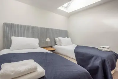 two beds sitting next to each other in a room at Print Rooms, Leiston in Leiston