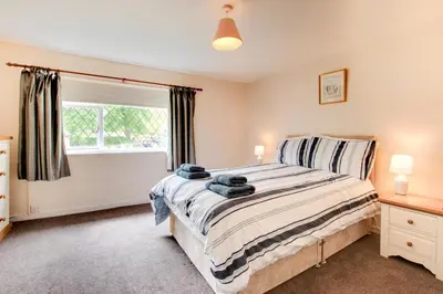 a bedroom with a bed and a window at 2 Bed in Dennington oc-b28010 in Dennington