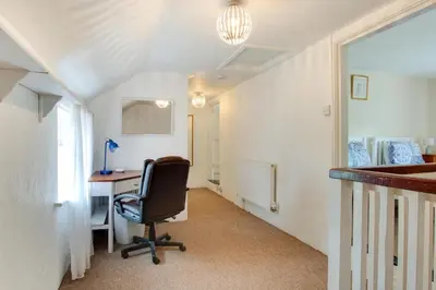an office with a desk and a chair in a hallway at 2 Bed in Dennington oc-b28010 in Dennington