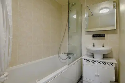 a bathroom with a sink and a toilet and a shower at 2 Bed in Dennington oc-b28010 in Dennington