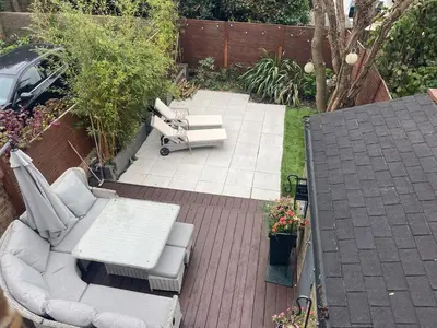 an overhead view of a patio with couches and a table at Seaside private garden in Leigh-on-Sea