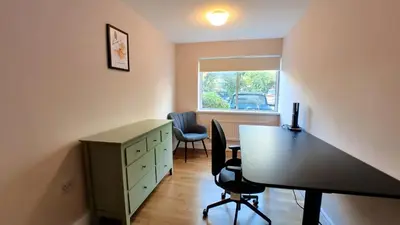 an office with a desk and a table and chairs at Lady Jane Court in Trumpington