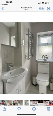 a white bathroom with a sink and a toilet at Kings head Inn in Stutton