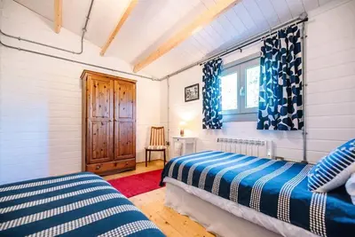 a bedroom with two beds and a window at The Cabin, Parham in Woodbridge