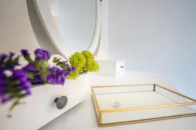 a table with a tray and flowers on it at Entire House in Ipswich - Handford in Ipswich