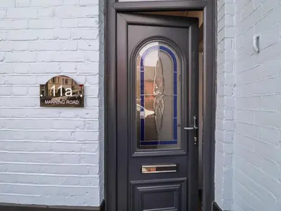 a black door with a window on a building at 11a Manning Road in Felixstowe