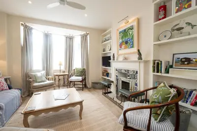 a living room with a couch and a fireplace at 17 Park Lane, Beautiful 4 bedroom house in the seaside town of Aldeburgh - Maximum occupancy of 7 guests - Aldeburgh Coastal Cottages in Aldeburgh