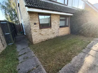 a backyard of a house with a fence at Grace's Place in Soham in Soham
