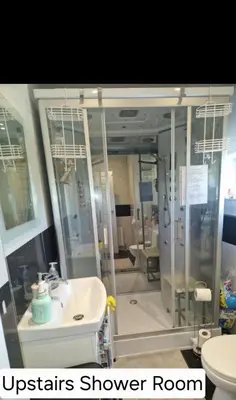 a bathroom with a shower room and a sink at Luxury on a Budget Chelmsford - B&B ROOM in a quiet family home in Chelmsford